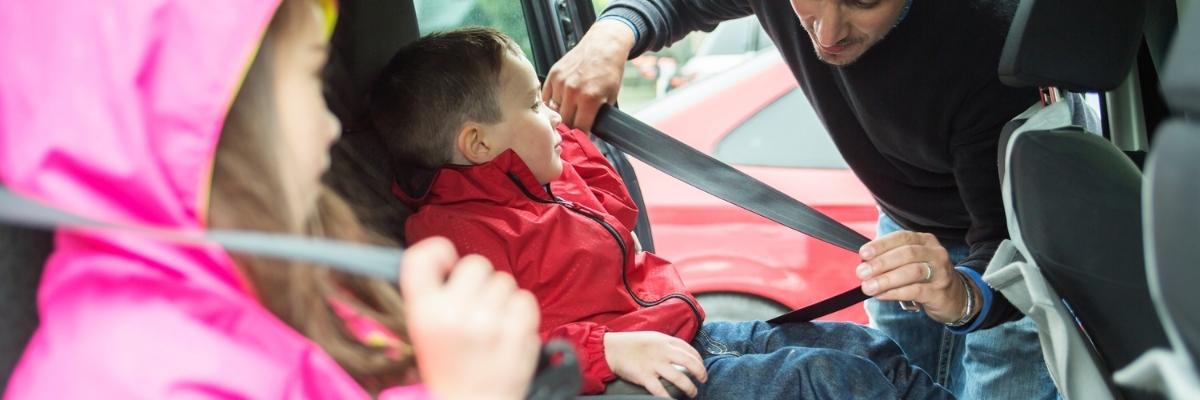 children putting on safety belts