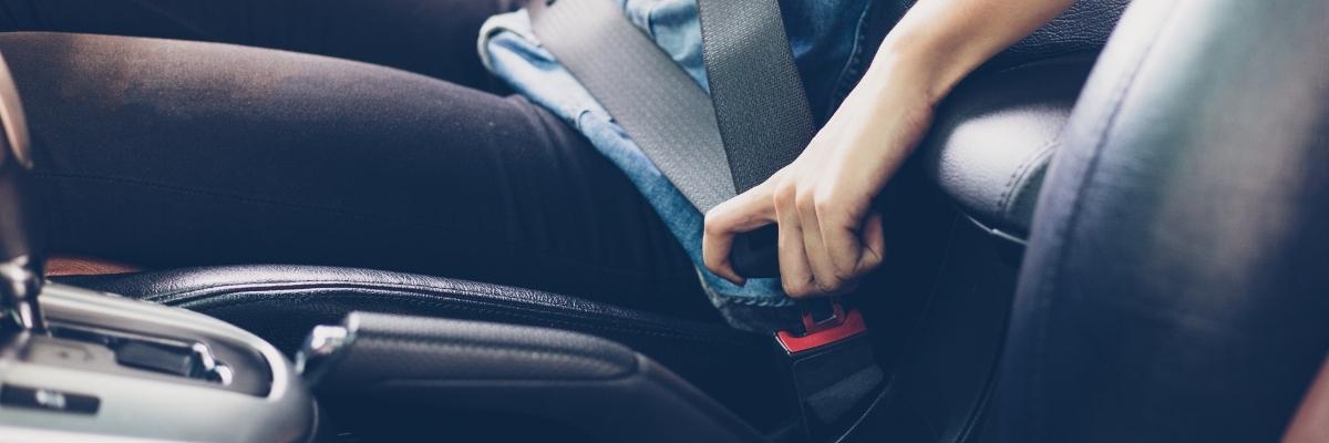 unbuckling seat belt safely